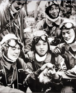 Five kamikaze pilots playing with a puppy, May 26, 1945
